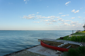 old canoe at lake sunset