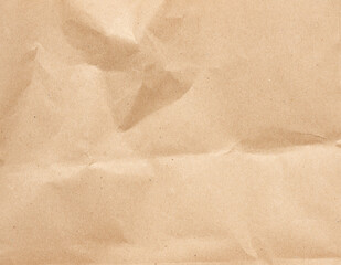 Naklejka premium crumpled blank sheet of brown wrapping kraft paper