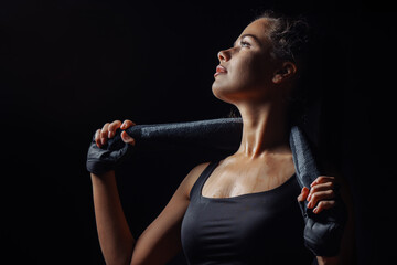 Sexy wet woman with black robe is tired after training.