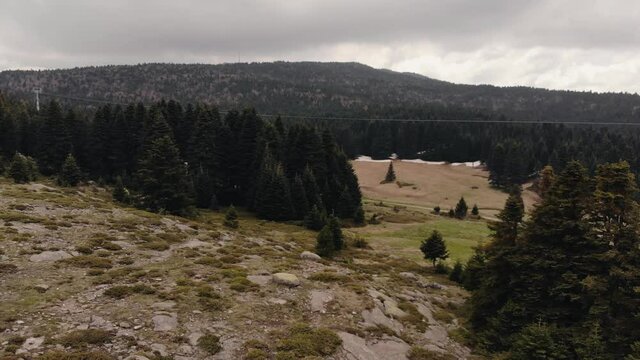 Aerial view of Uludag, Bursa, Turkey. Endless nature with mountains. Hills covered with green spruce trees 