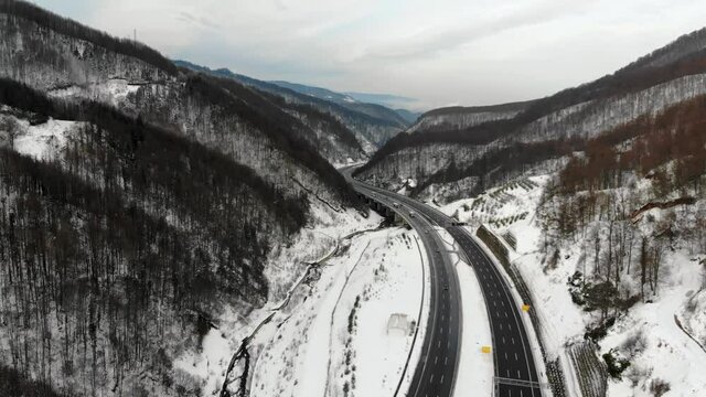 Aerial view of winter road  between mountains in Abant. Bolu region, Turkey. Drone footage 4K 