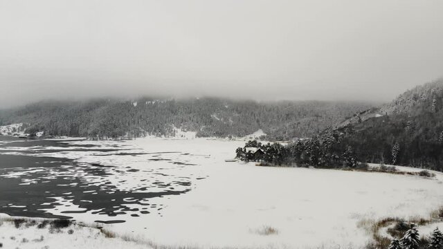 Aerial footage of Abant national park in  snowy winter time. Beautiful landscape with frozen lake. Bolu, Turkey. 
