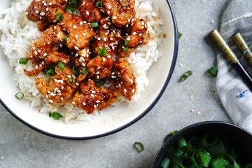 Homemade sesame Chicken served with Jasmine white rice, selective focus