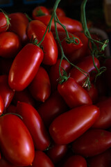 Beautiful red  tomatoes on the counter in the market in daylight organic food