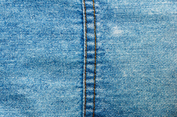 clothing items blue stonewashed faded jeans cotton fabric texture with seams, clasps, buttons and...