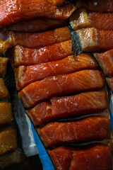 Beautiful smoked red fish fillet on the counter in the market gourmet