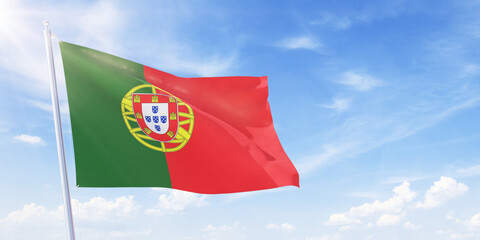 Portuguese flag on a flagpole waving in blue cloudy sky. Portugal concept 3D rendering