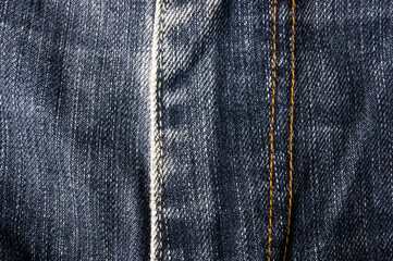clothing items blue stonewashed faded jeans cotton fabric texture with seams, clasps, buttons and...