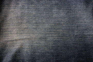 clothing items blue stonewashed faded jeans cotton fabric texture with seams, clasps, buttons and...