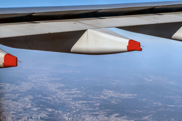 Naklejka na ściany i meble Commercial aircraft wing in flight