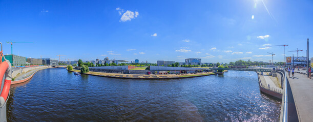 View from Berlin main station square over river Spree to the government quarter in summer