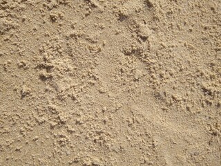 The structure of the sand on the Mediterranean coast close-up, abstraction.
