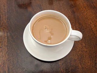 cup of coffee on wooden table