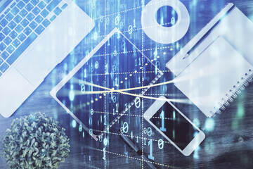 Double exposure of technology theme drawing over work table desktop. Top view. Global data analysis concept.