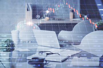 Double exposure of stock market graph drawing and office interior background. Concept of financial...