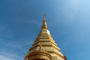 The golden pagoda with blue sky background.