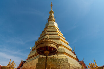 Fototapeta premium The golden pagoda with blue sky background.