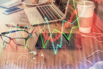 Double exposure of financial graph drawing and cell phone background. Concept of forex trading