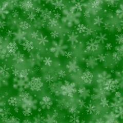 Christmas seamless pattern of snowflakes of different shapes, sizes, blur and transparency on green background