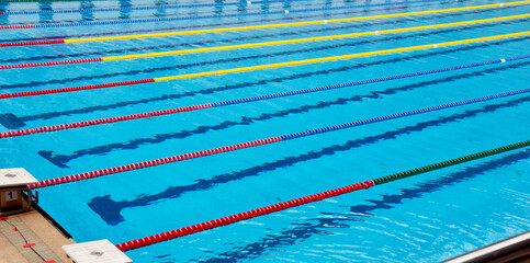 Soft waves in swimming pool. Background and texture of natural crystal clean water.