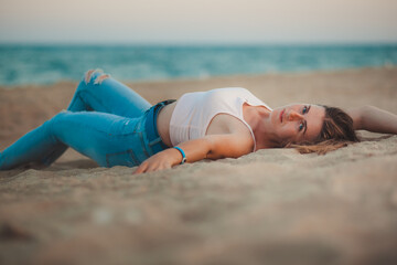 sexy young model by the sea on the beach
