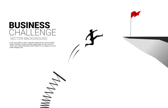 Silhouette of businessman jump to red flag on cliff with springboard. Concept of boost and growth in business.