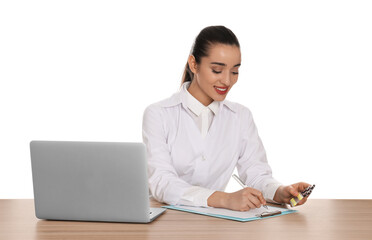 Professional pharmacist working at table against white background