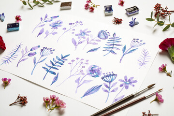 Composition with floral picture and watercolor paints on white background