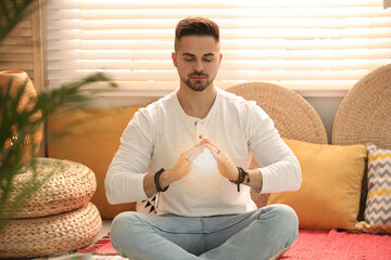 Young man during self-healing session in therapy room