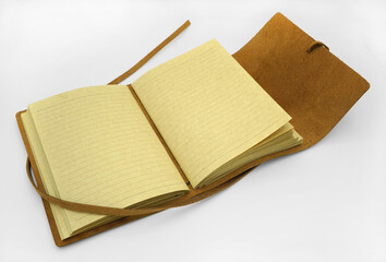 Open Brown Leather bound personal journal on white background.