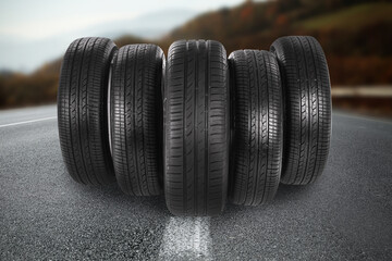 Black car tires on asphalt road outdoors © New Africa