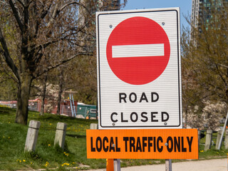 a red circle traffic sign saying Road Closed Local Traffic Only