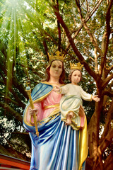 Fototapeta na wymiar Statue of Our lady and child Jesus in catholic church, Thailand. selective focus.