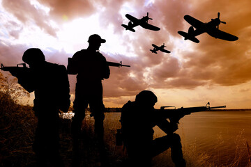 Silhouettes of soldiers with assault rifles and military airplanes patrolling outdoors