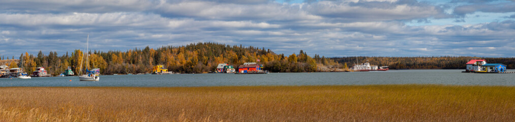 Panoramic photo of houseboats on the Great Slave Lake in Yellowknife, Northwest Territories in Canada