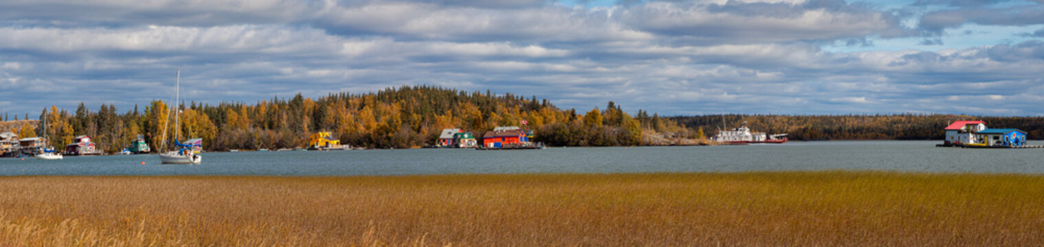 Panoramic photo of houseboats on the Great Slave Lake in Yellowknife, Northwest Territories in Canada