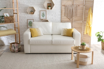 Comfortable white sofa in modern room. Interior design