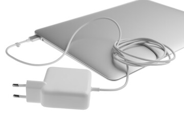 Laptop and charger on white background. Modern technology