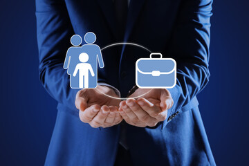Man holding virtual icons against blue background, closeup. Concept of balance between life and work