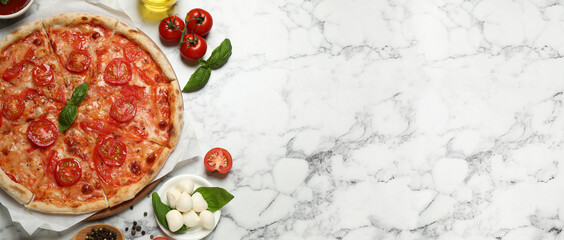Top view of hot delicious pizza on light marble table, space for text. Banner design