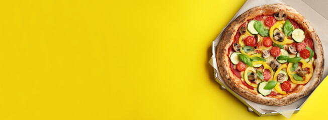 Top view of hot delicious pizza on yellow background, space for text. Banner design
