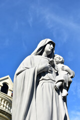 Fototapeta premium Statue of Our lady and child Jesus in catholic church, Thailand. selective focus.