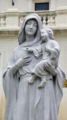 Fototapeta premium Statue of Our lady and child Jesus in catholic church, Thailand. selective focus.