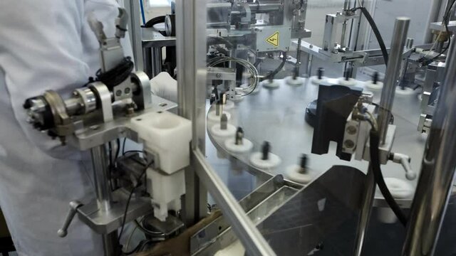 utomated equipment for production decorative cosmetics in factory.