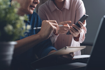 Two colleagues asian businesspeople together working and making discussion in office