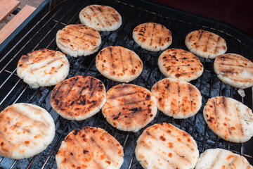 Grilled cheese arepas, made with cornmeal and cheese. Popular dish from Colombia.
