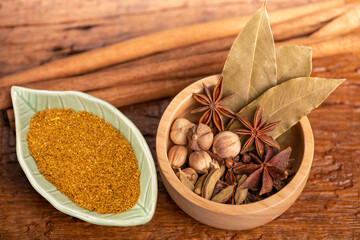 Spices and herbs ingredients for cooking Curry, Spices and herbs ingredients for cooking Curry, Curry powder, clove, cardamom, cinnamon, caraway on wooden background.
