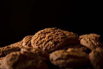 Close-up of cookies isolated on black background free text