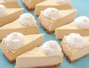 cheesecake pattern, servings of cheesecake on a blue background top view