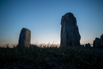Evening twilight picture of Ales Stenar megalithic stone ship monument taken from a low perspective.